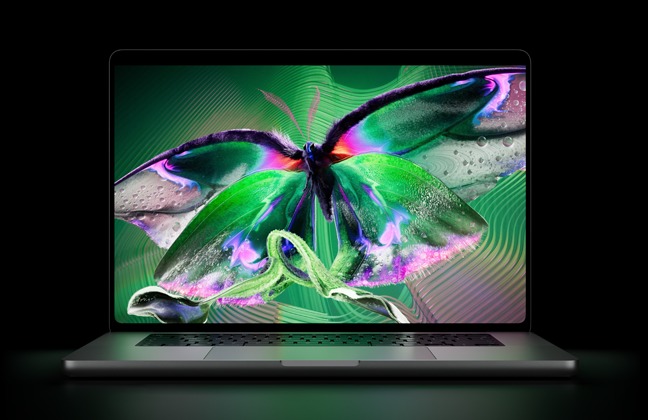 MacBook Pro avec Écran PROLED XDR, ouvert, argent, l’écran affiche une image détaillée au contraste élevé avec des couleurs éclatantes, l’écran illumine le clavier